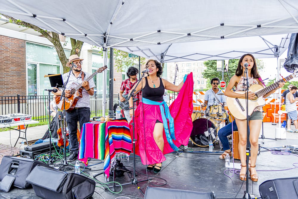 Local events, including Chalk Fest, featured local performers, artists, and musicians to celebrate the local history, culture, and diversity of neighborhood organizations, businesses and residents. | Image Credit: Chris Gullien